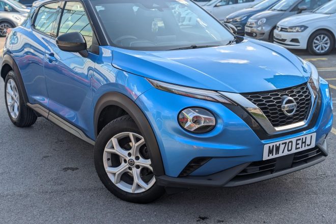 Blue Nissan Juke 1.0 DIG-T Acenta SUV parked in dealer forecourt, front three-quarter view - 313 Motors, Oldham
