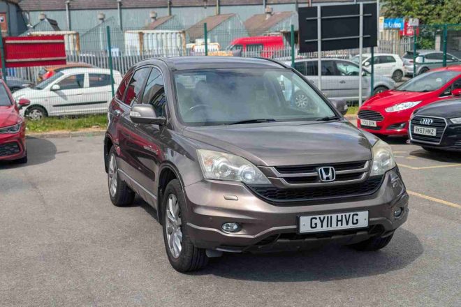 Bronze Honda CR-V 2.2 i-DTEC EX 4WD SUV parked at 313 Motors dealership in Oldham, front three-quarter view