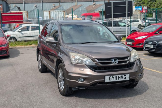 Bronze Honda CR-V 2.2 i-DTEC EX 4WD SUV parked at 313 Motors dealership in Oldham, front three-quarter view