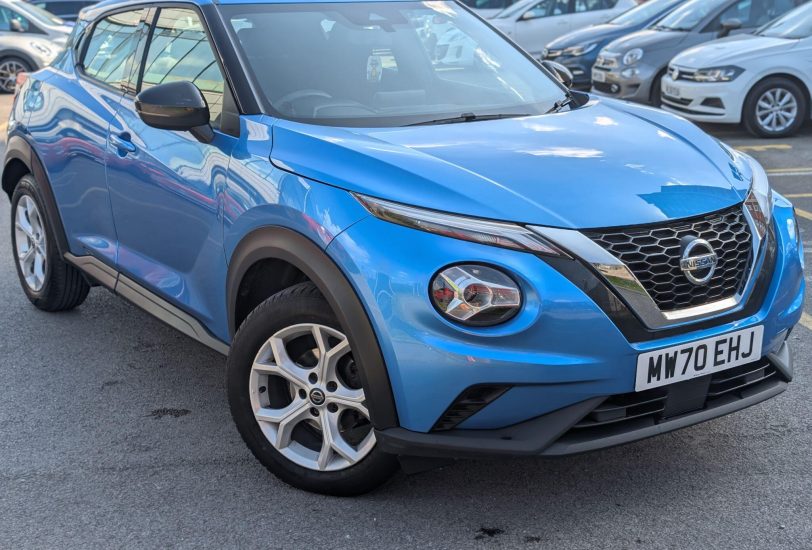Blue Nissan Juke 1.0 DIG-T Acenta SUV parked in dealer forecourt, front three-quarter view - 313 Motors, Oldham