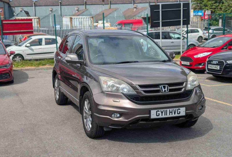 Bronze Honda CR-V 2.2 i-DTEC EX 4WD SUV parked at 313 Motors dealership in Oldham, front three-quarter view