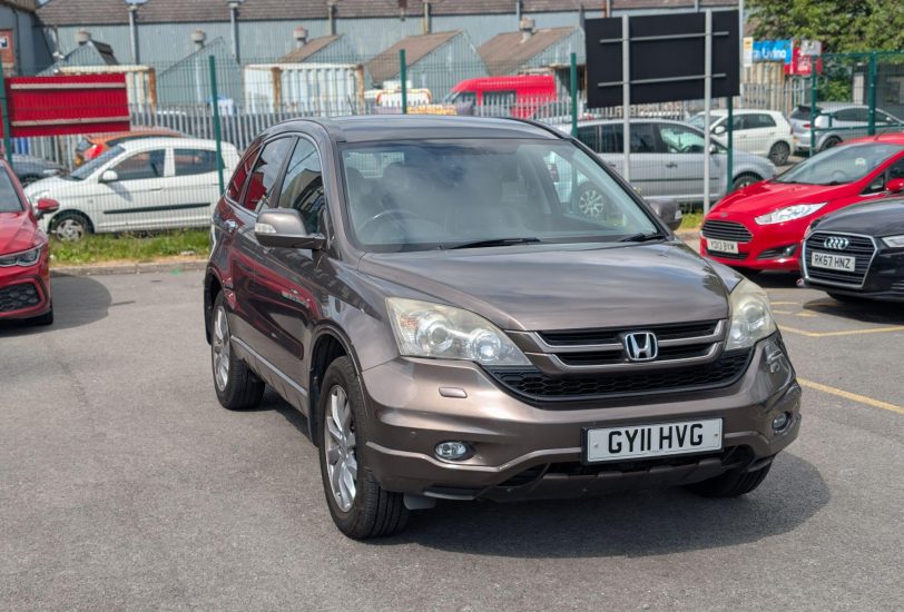 Bronze Honda CR-V 2.2 i-DTEC EX 4WD SUV parked at 313 Motors dealership in Oldham, front three-quarter view